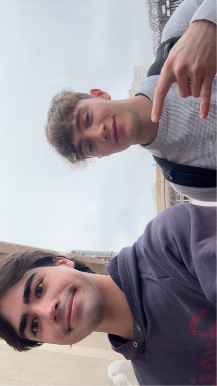 A close, tilted selfie outdoors.