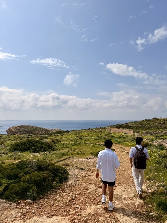 Walking a coastal path above the sea.