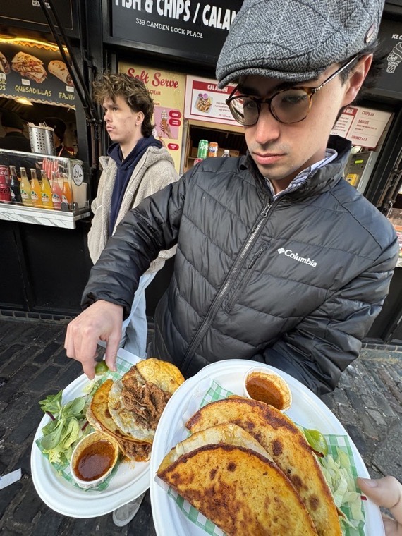 Street food stall, holding two loaded plates.