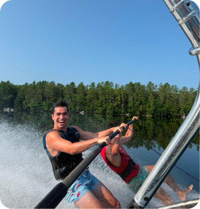 Barefoot waterskiing on a lake.