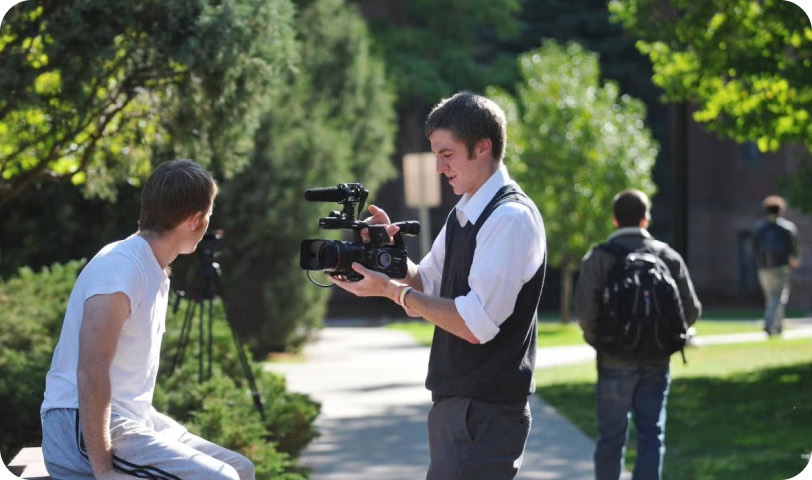 Filming an interview on campus during the school year.