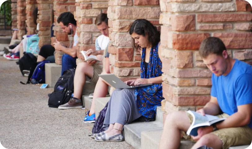 Reviewing a cut with the team outside on campus.